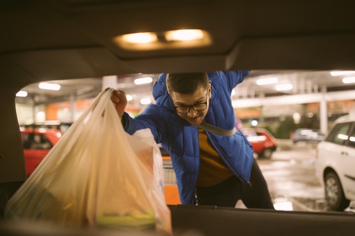 man loading car