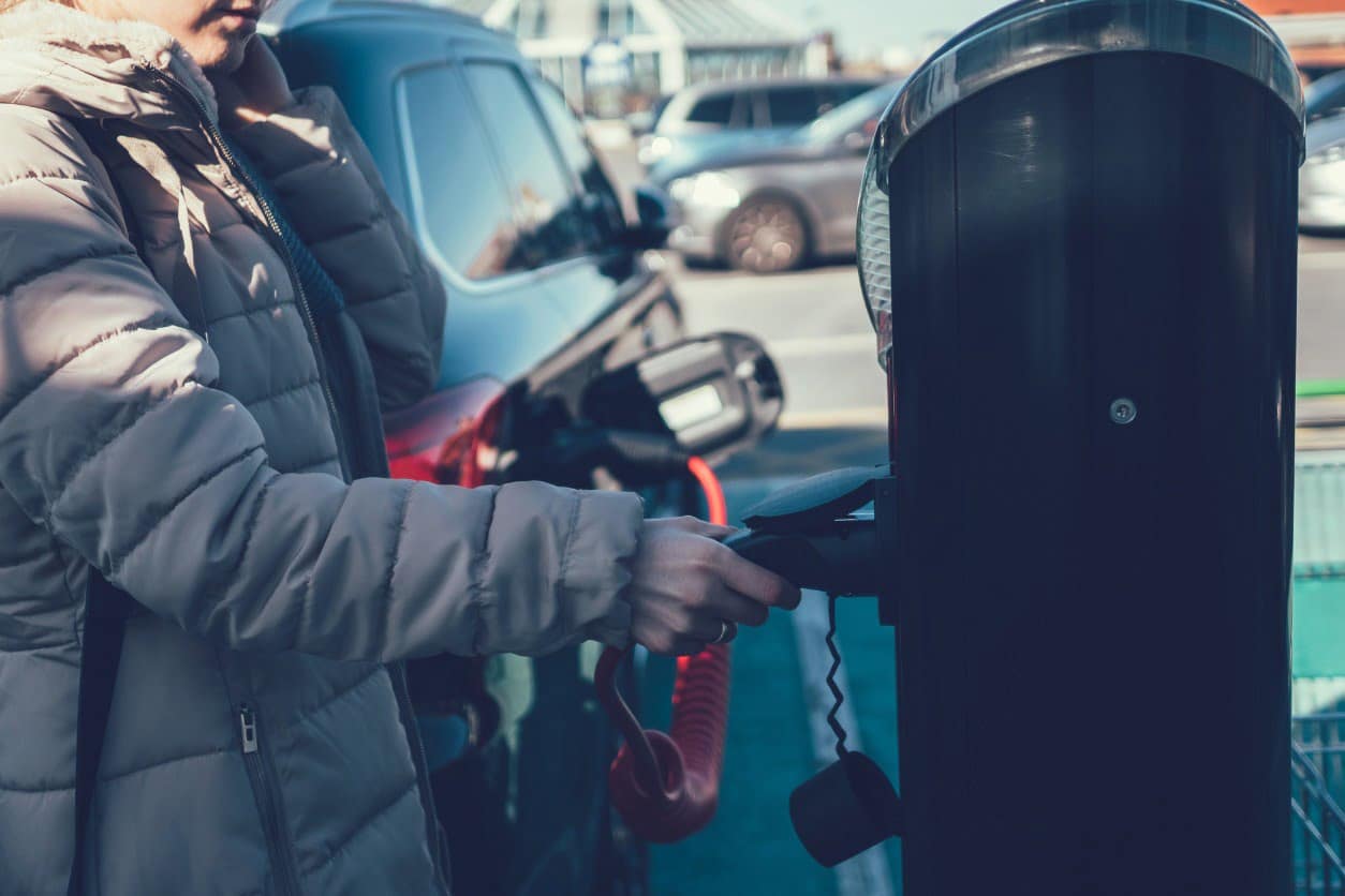 woman at electric charger