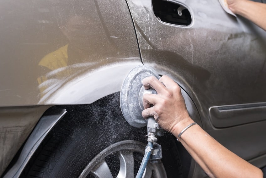 Sanding a car before painting